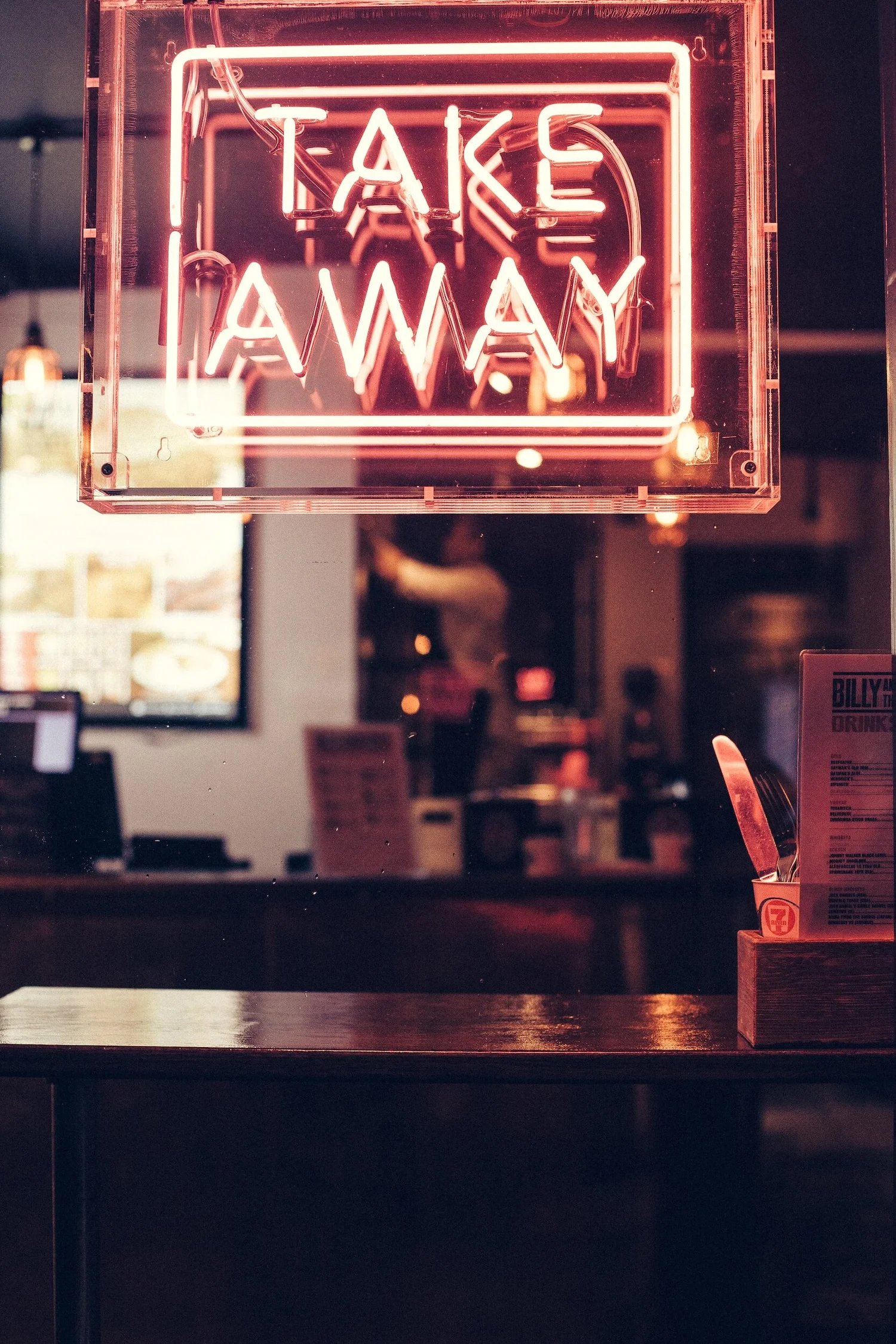 A neon takeaway sign
